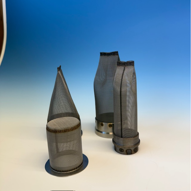 A group of spark arrestors upright against a blue and peach background